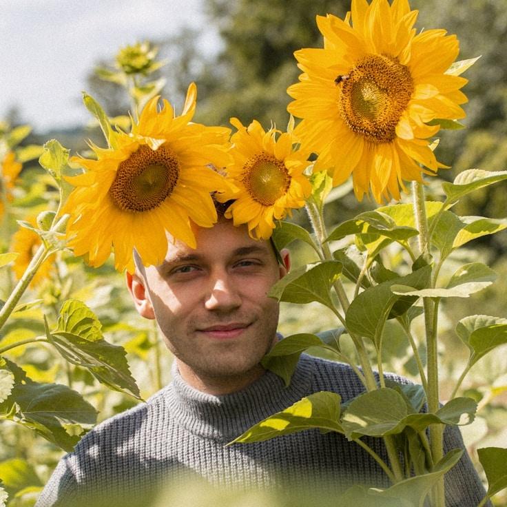 Avery Chen, Lead Design Curator at Open River Community, reviewing corporate floral arrangements